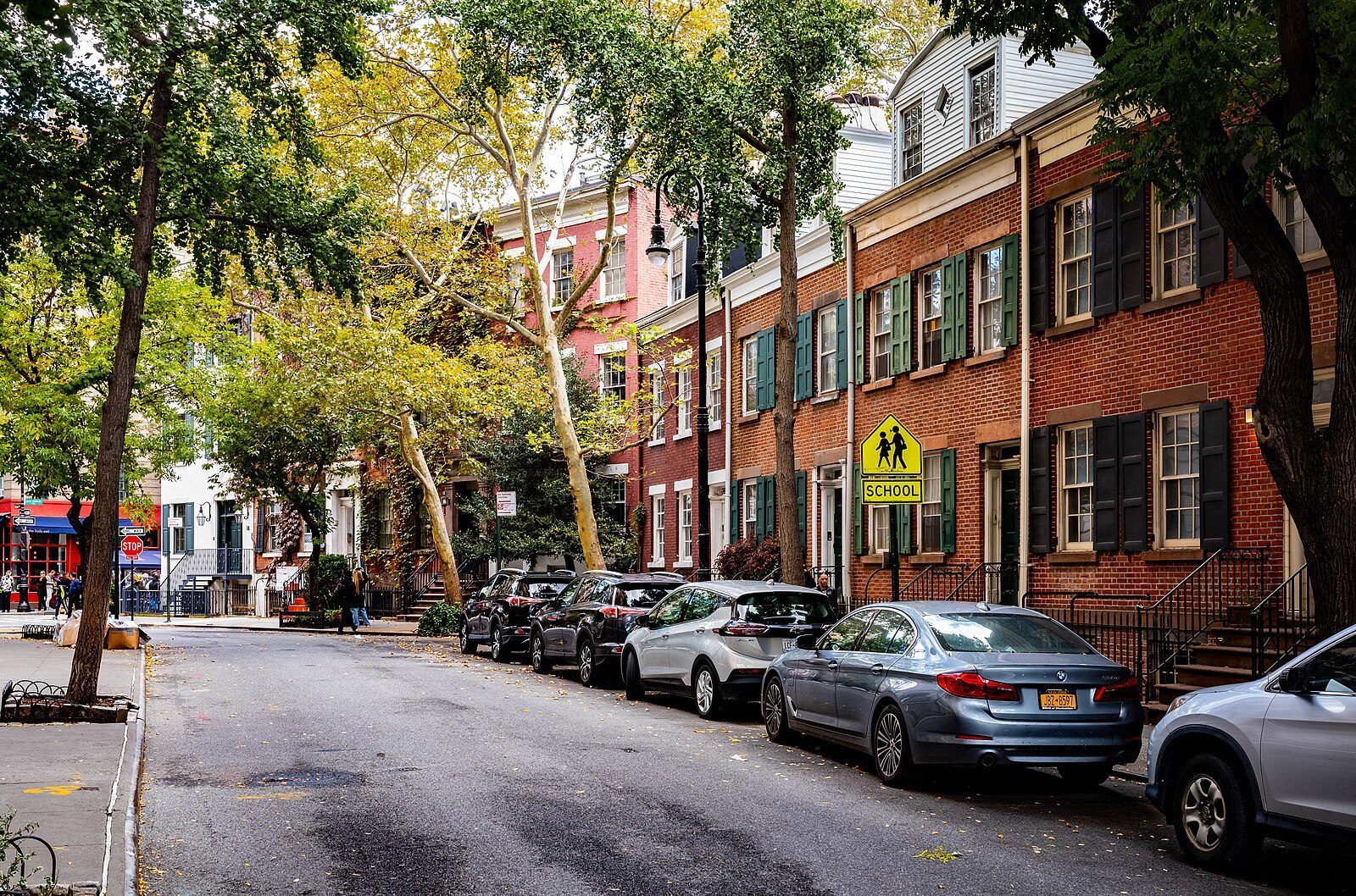 Grove Street in the West Village, brick row houses under street trees